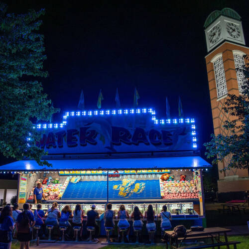 carnival game, water race, set up at night near cook carillon tower